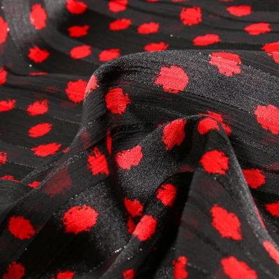 Tissu Mousseline Dots Lurex rouge sur fond Noir - Par 10 cm