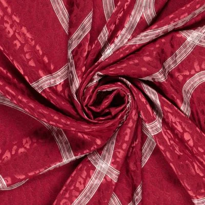 Tissu Satin imprimé Relief léopard sur fond Rouge - Par 10 cm