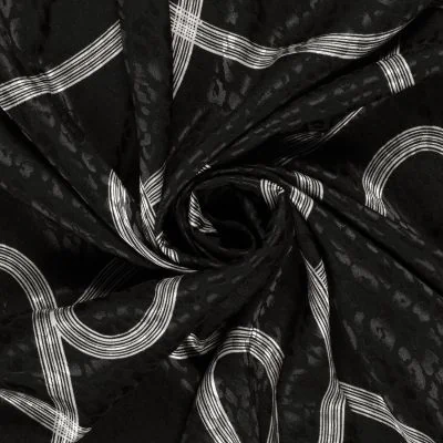 Tissu Satin imprimé Relief léopard sur fond Noir - Par 10 cm