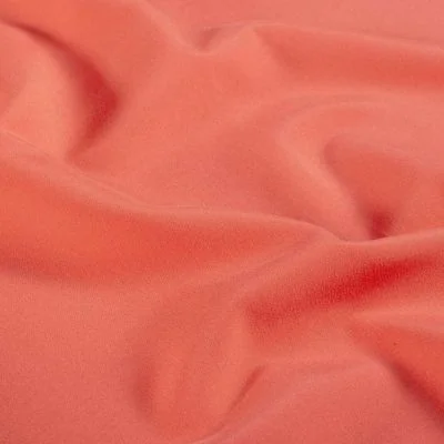 Tissu Short de bain déperlant recyclé Solina sur fond Corail - Par 10 cm