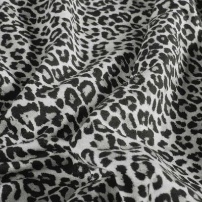 Tissu Sweat léger French Terry Maïa extensible léopard Noir sur fond Blanc - Par 10 cm